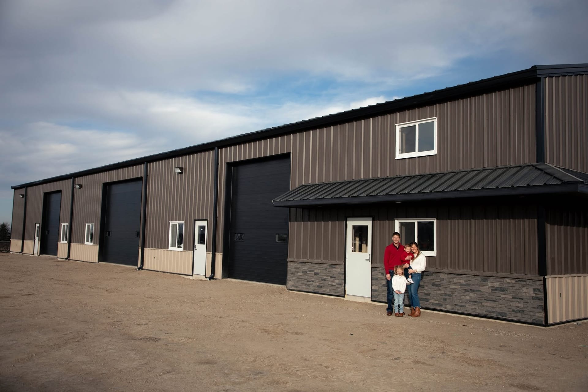The Kandi Collision & Color building with its row of overhead bay doors